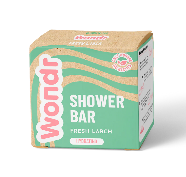 A packaged shower bar product labeled 'WONDR SHOWER BAR FRESH LARCH' with a beige and green color scheme.