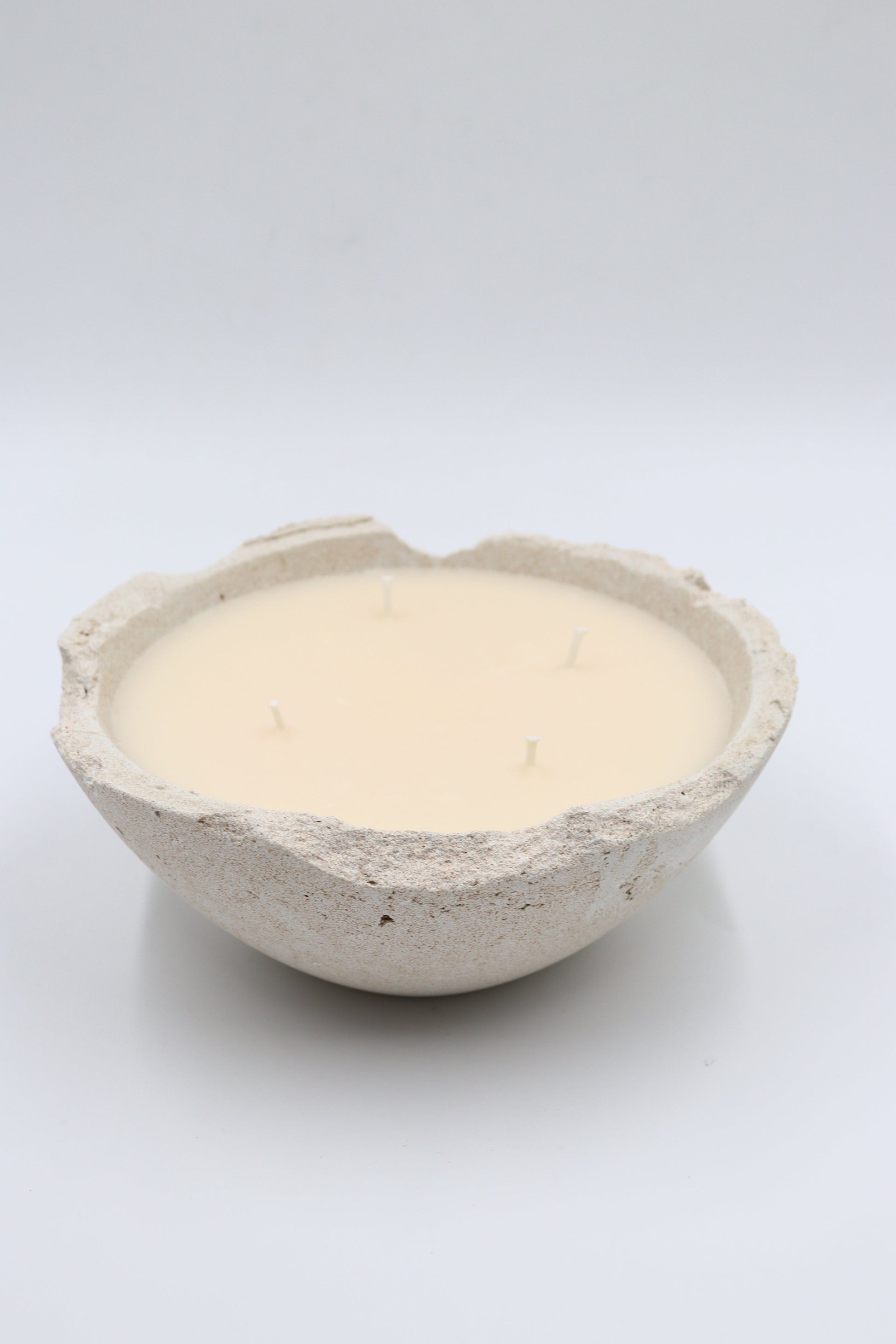 Luxury scented soy wax candle made in concrete bowl in Dubai