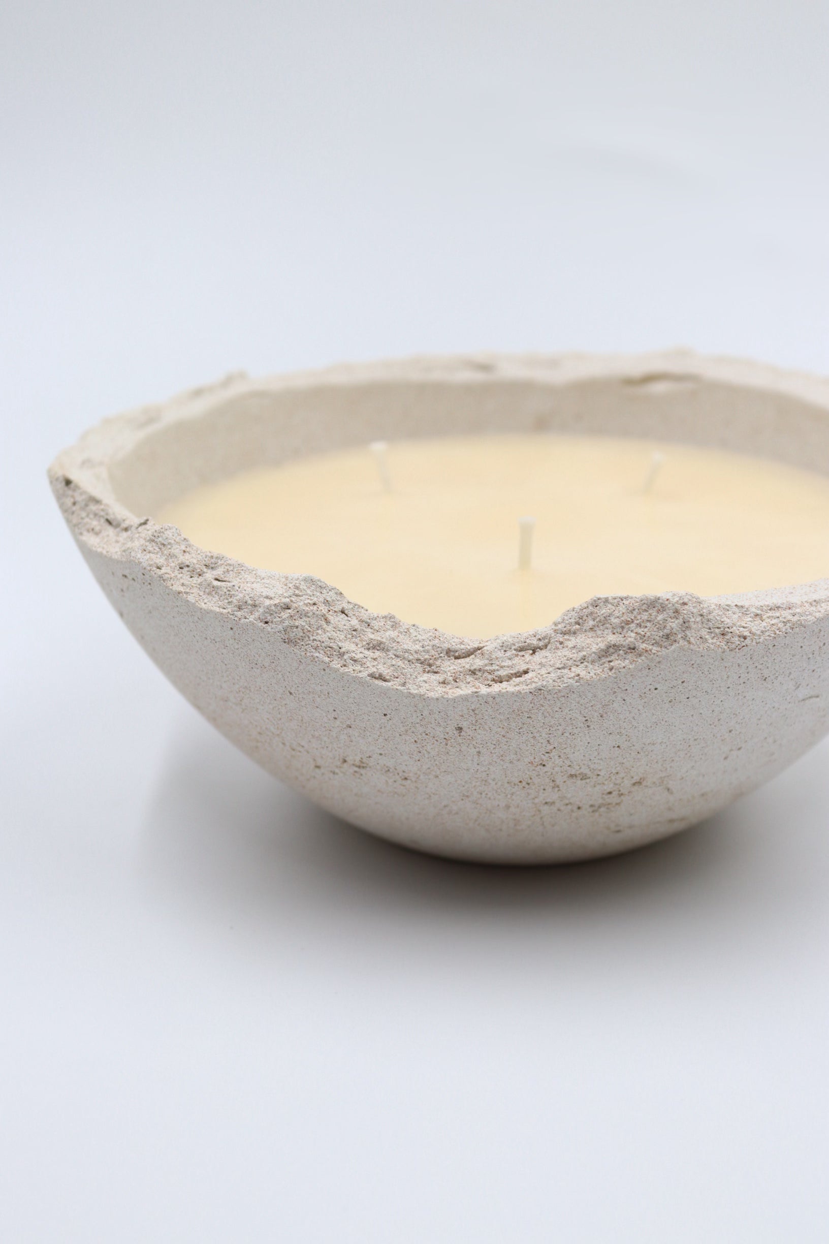 Handpoured in Dubai scented soy wax bowl candle in handmade concrete Eries vessel
