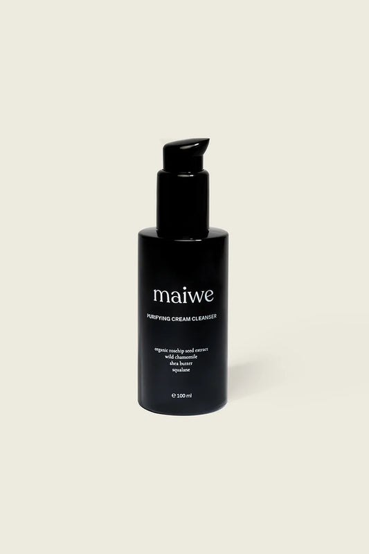 A black pump bottle labeled 'maiwe' containing cream cleanser.