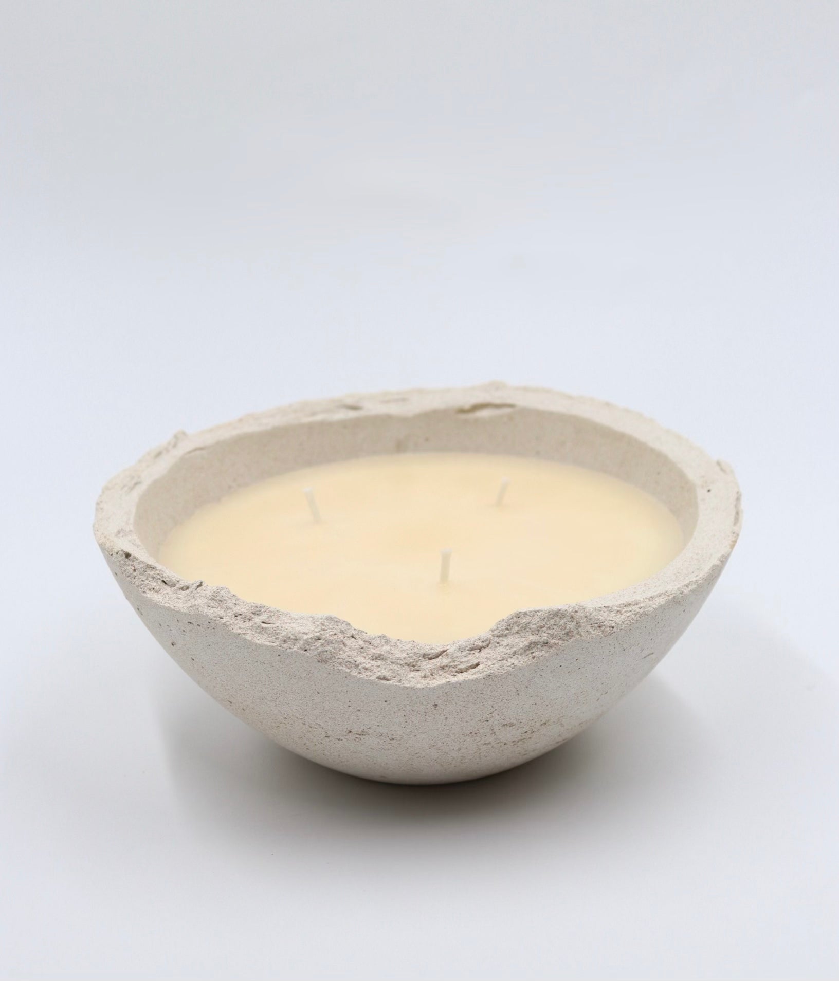 Non toxic and sustainable scented soy wax bowl candle in handmade concrete Eries vessel